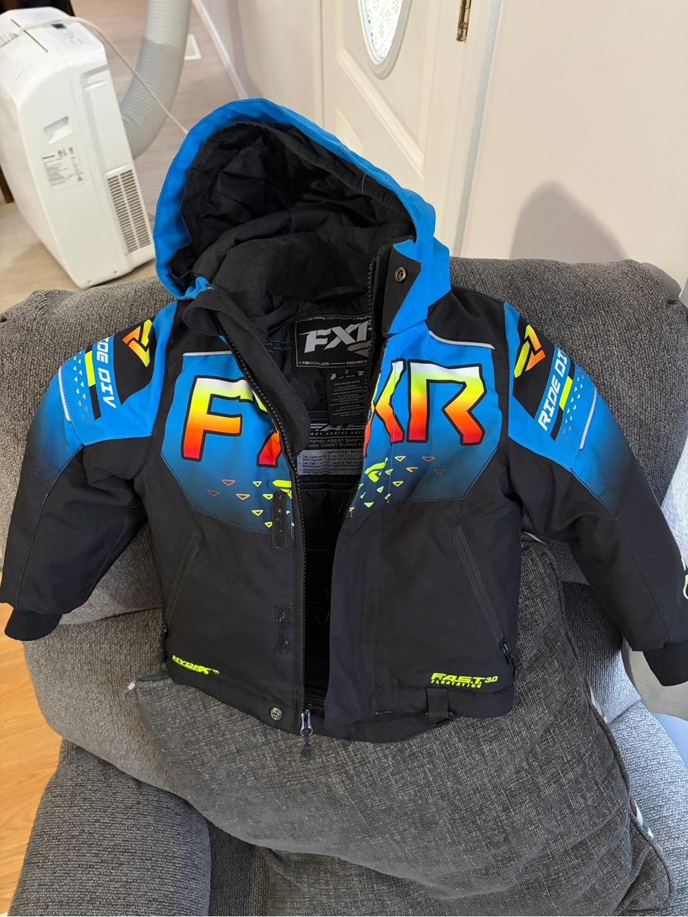 FXR Kids' Black & Blue Hooded Puffer Jacket with Neon Accents